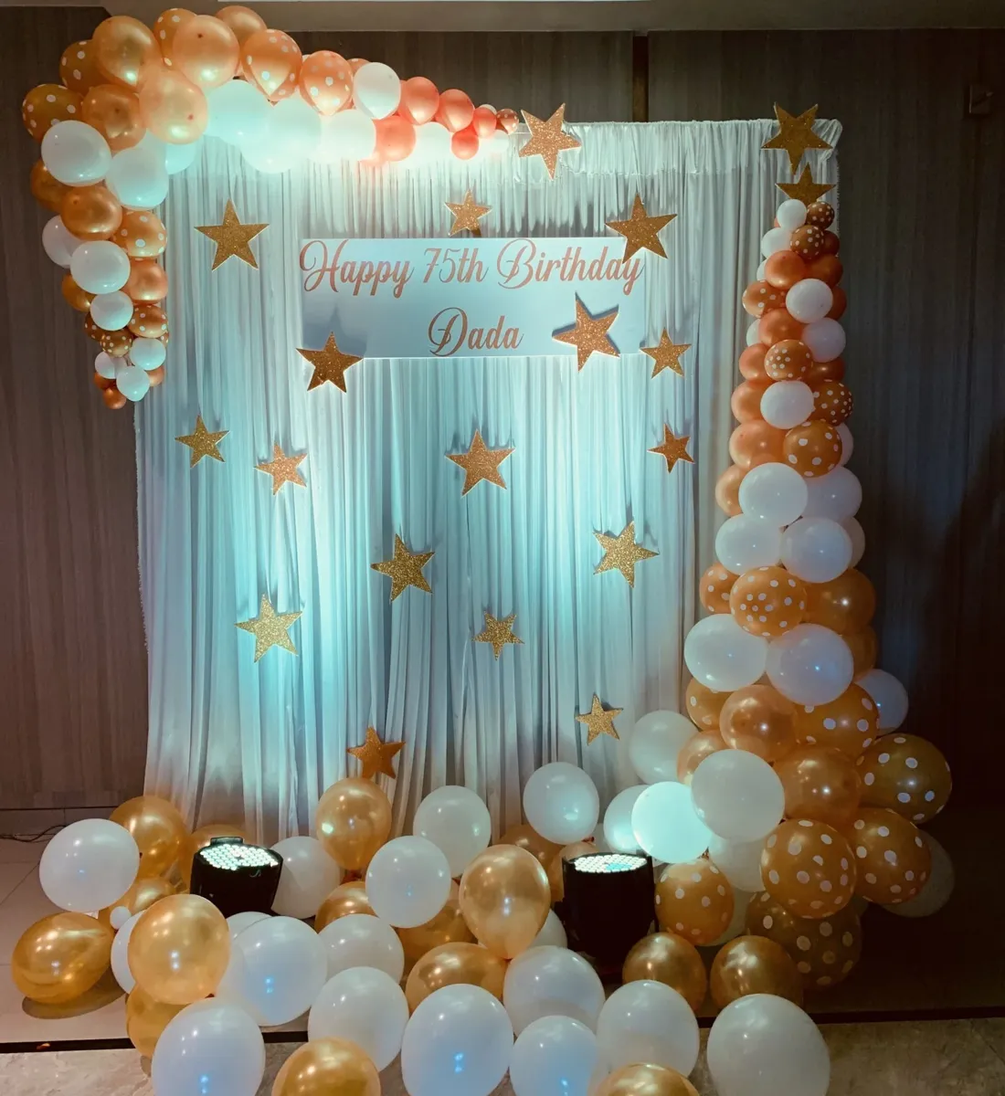 Birthday backdrop with gold and white balloons